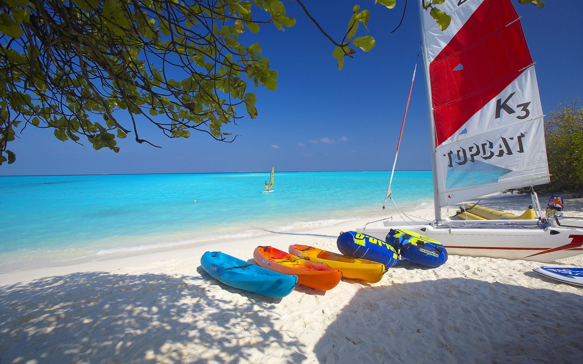 board sail catamaran boat sea beach sand sky