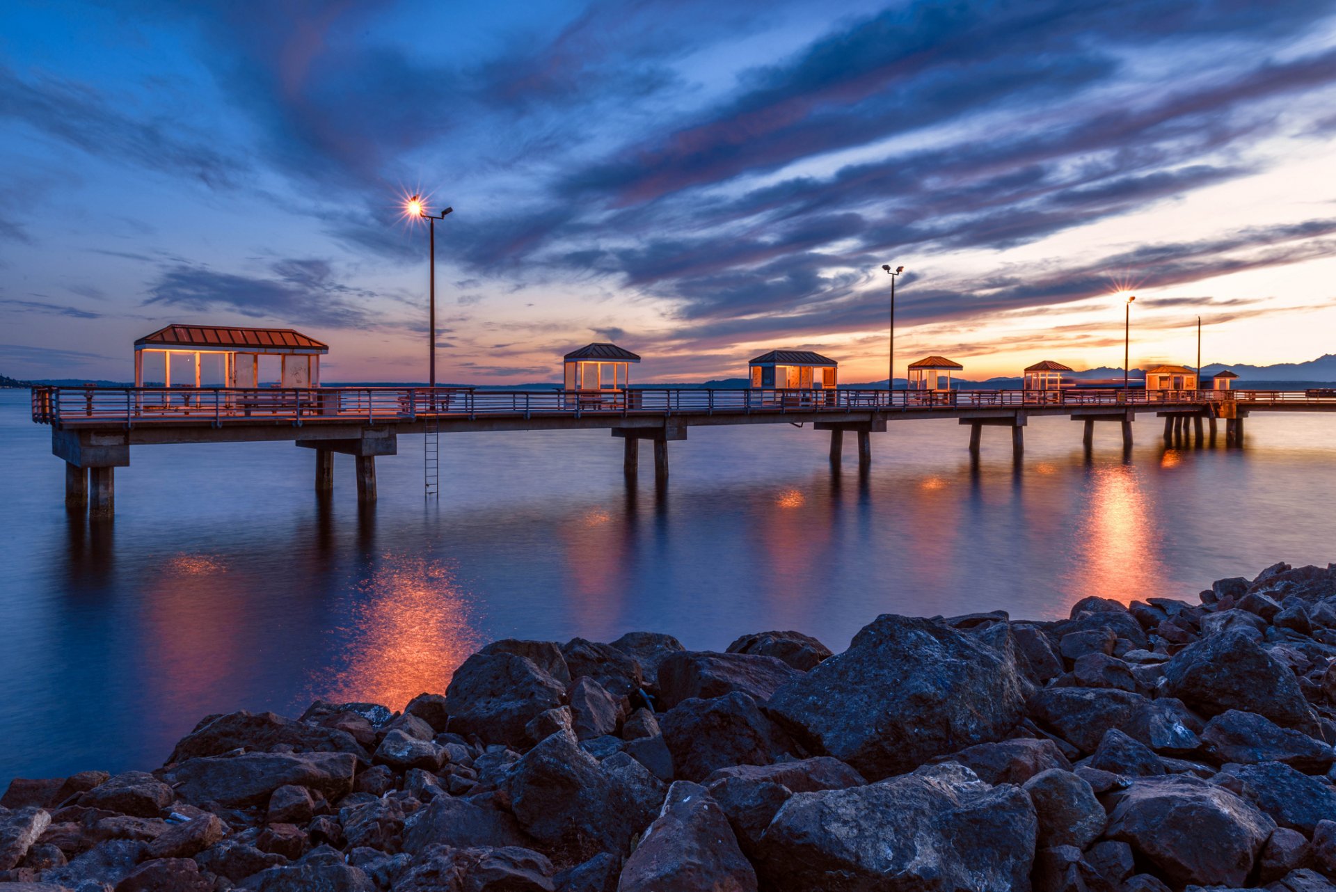 ocean beach stones pier for fishermen landscape