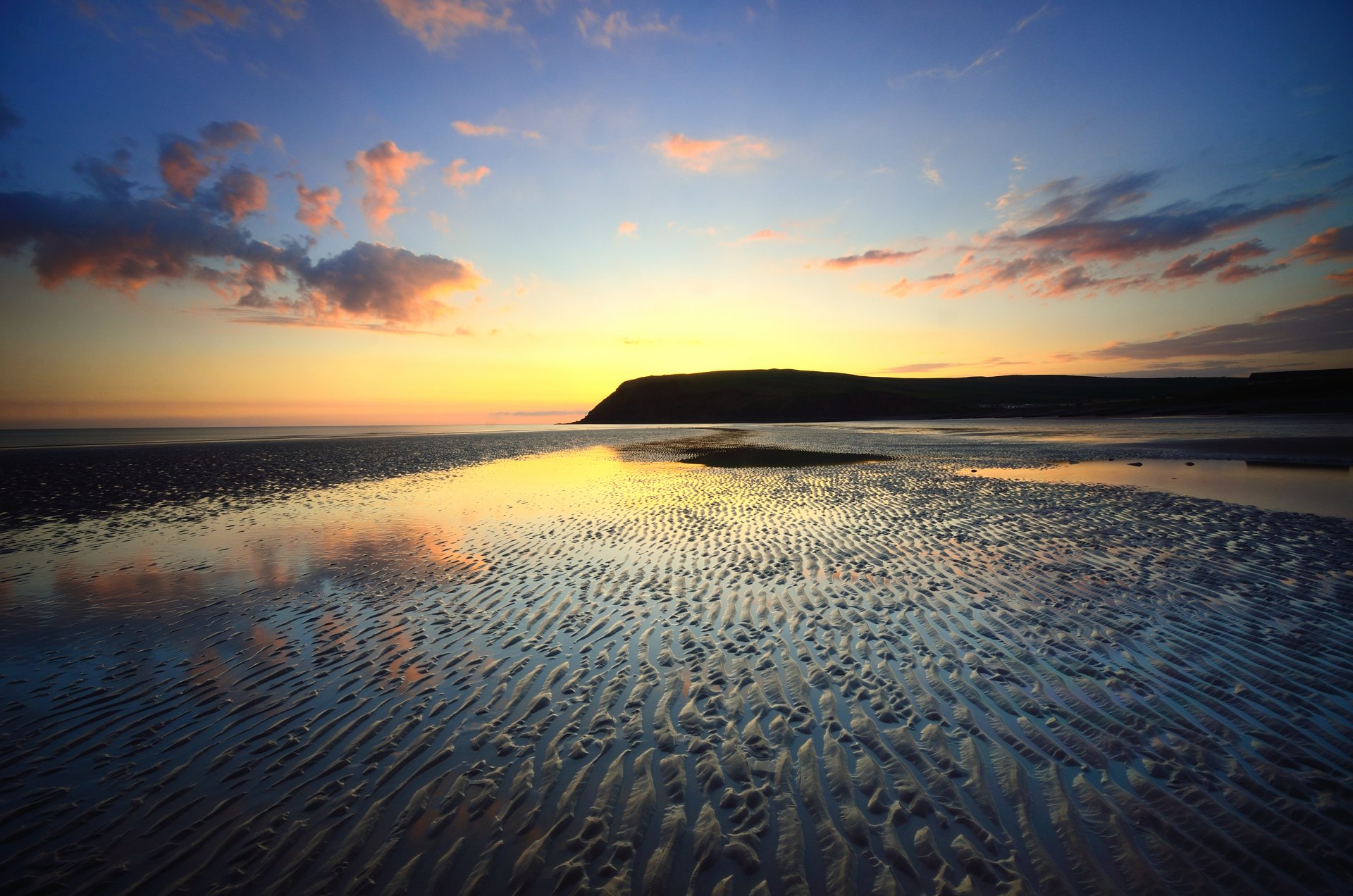 ea tide beach sand sky clouds sunset