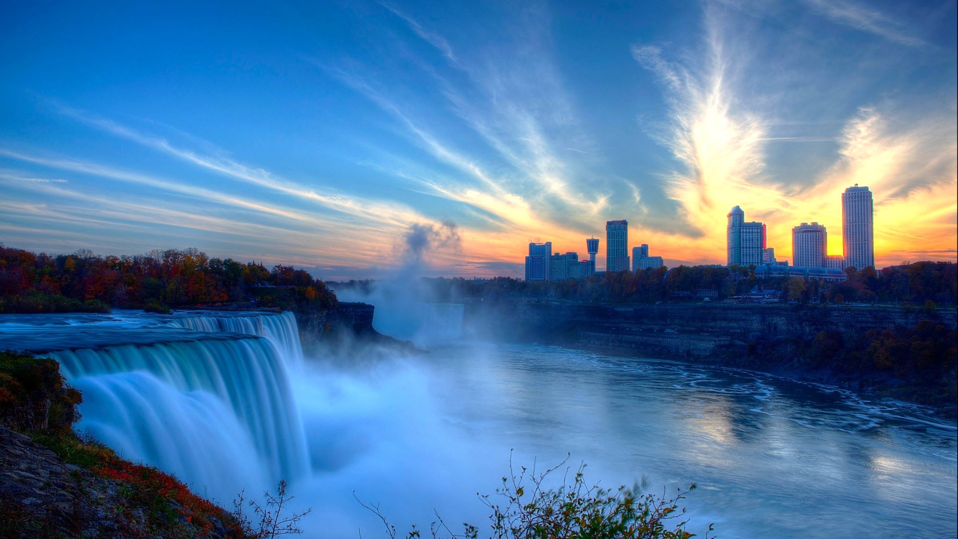 wodospad niagara niebo domy rzeka zachód słońca rozpryski