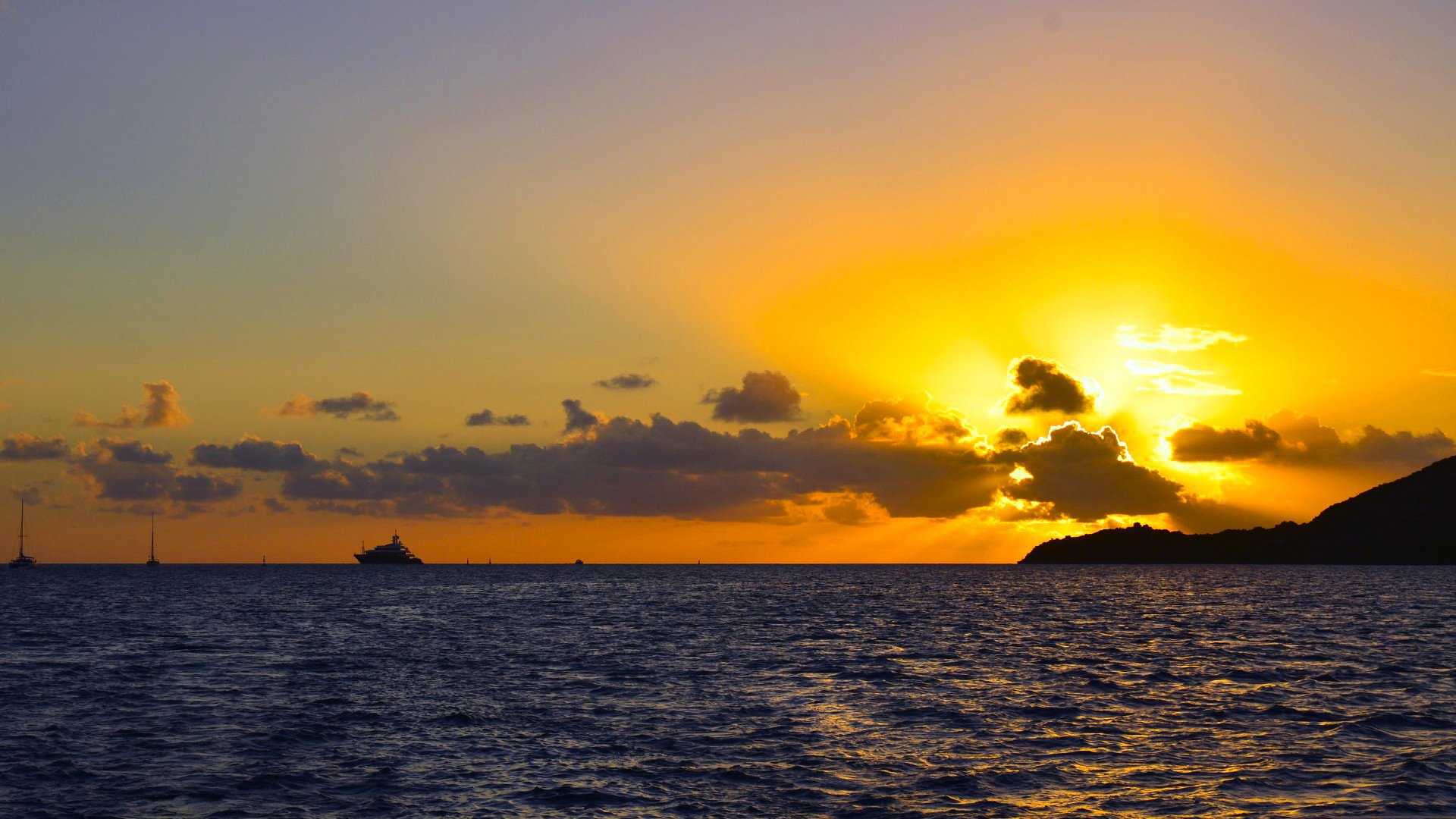 ky clouds sunset sea mountain yacht horizon rays nature