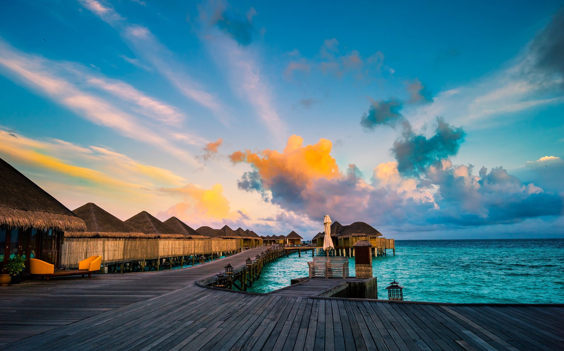 the maldives tropics sea bungalow sky clouds horizon