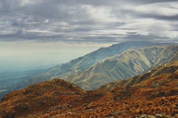 Foggy clouds in the mountains, around the rocky mountains