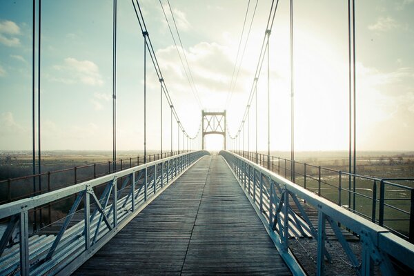 A bridge stretching into the distance of sunlight