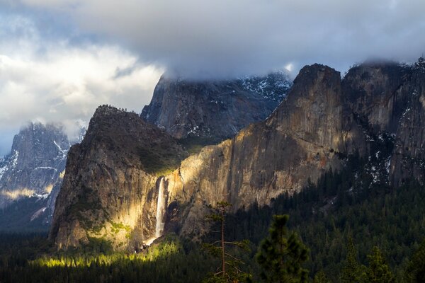 The magical light falling on the mountains through the canvas of clouds