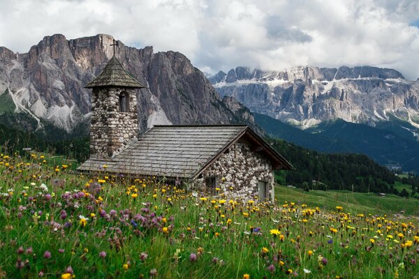 Church in the Alps at the foot of the mountains