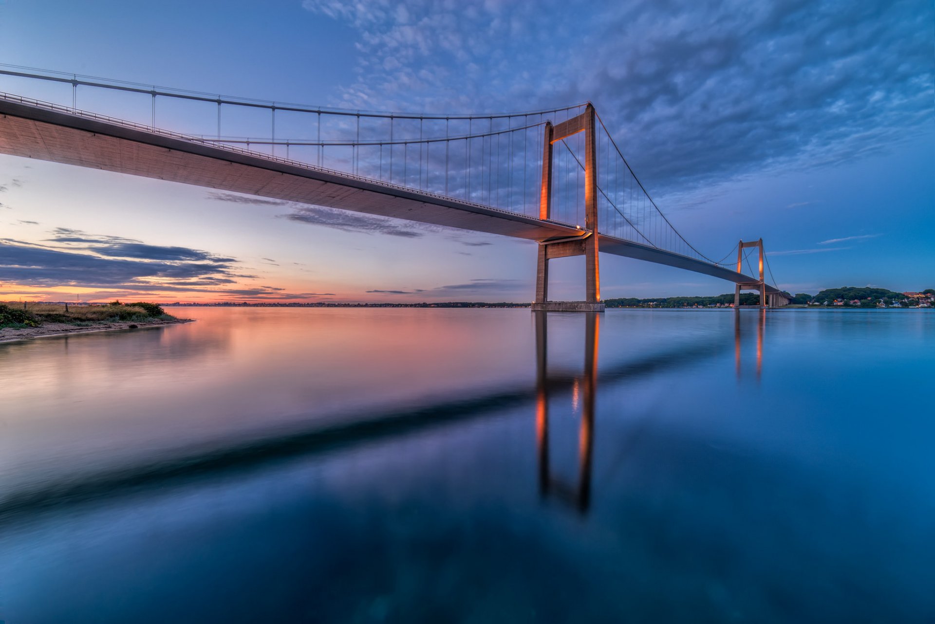 denmark little belt bridge bridge strait night sunset sky clouds reflection