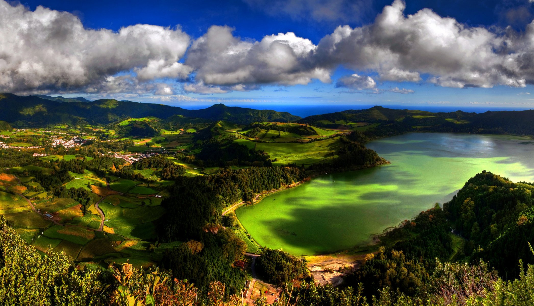 hills meadows of the field green grass the distance horizon sky clouds beauty