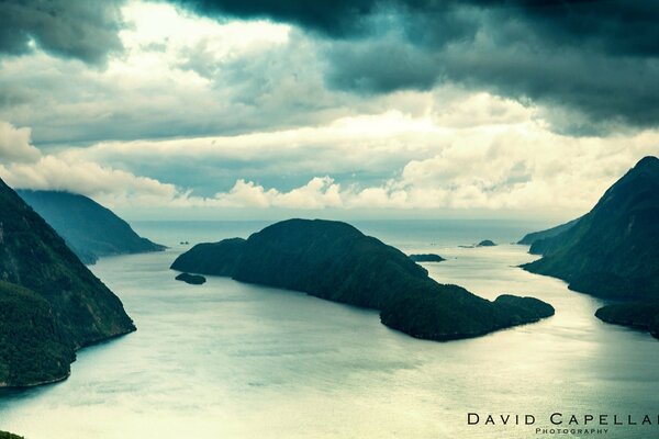 Mountains and sea on the background of clouds