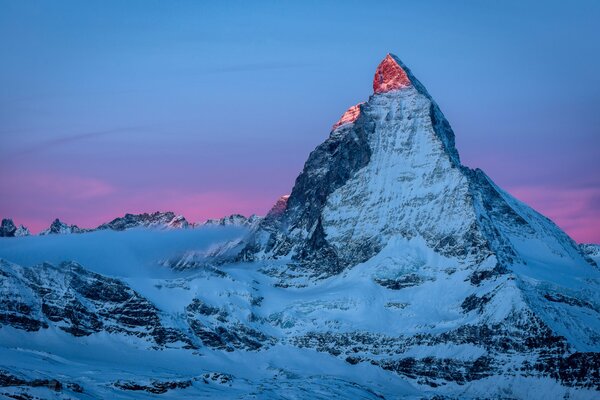 The Alps mountains at dawn at the first rays of the sun