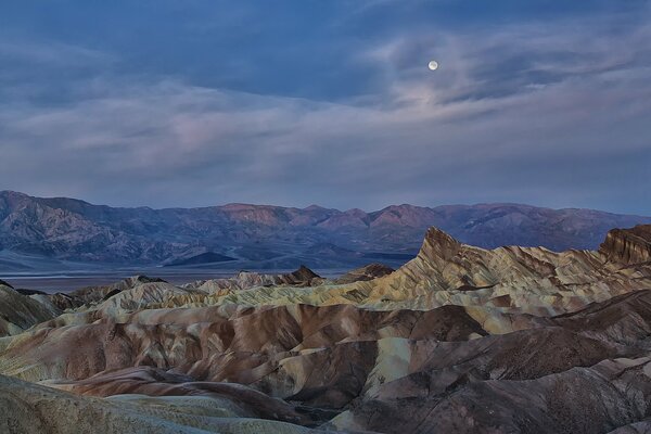 Mountain peaks by moonlight