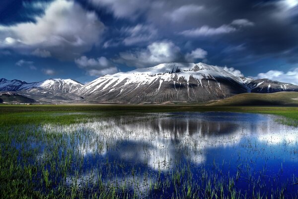 Landscape pond on the background of mountains