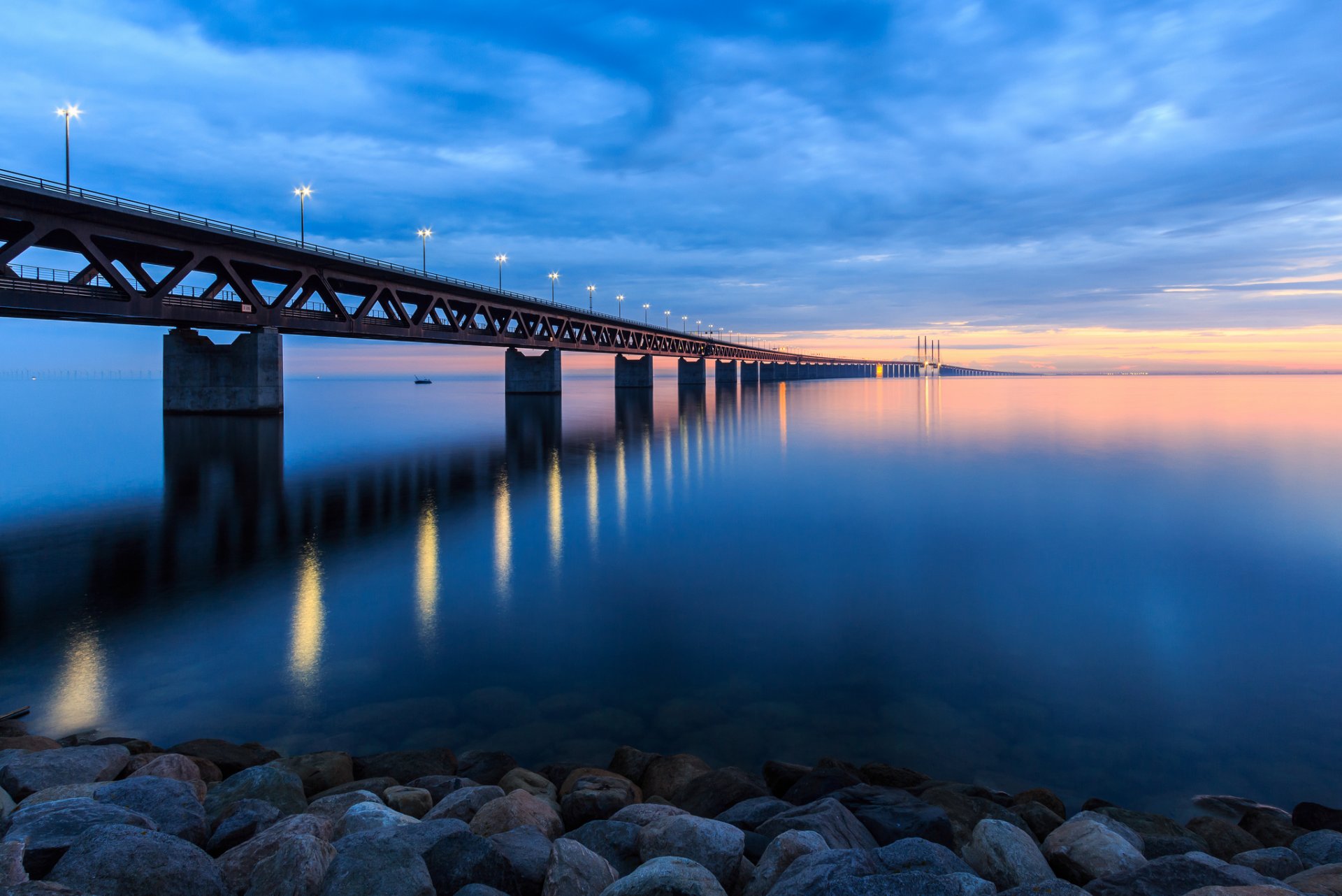 weden bridge lights lanterns shore rocks strait evening sunset sky clouds clouds landscape