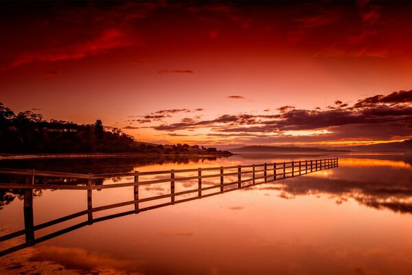 A blood-red sunset over the lake. landscape