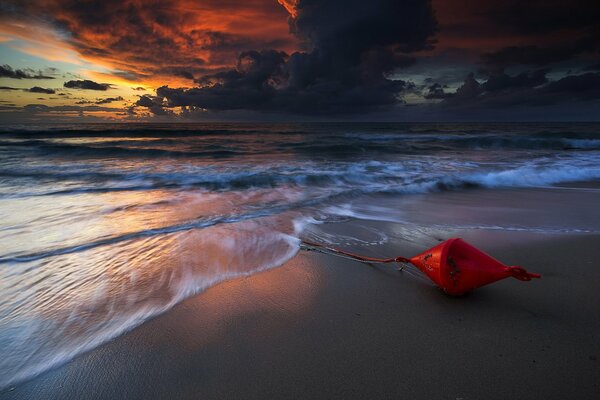 Wonderful landscape foamy sea with sunset