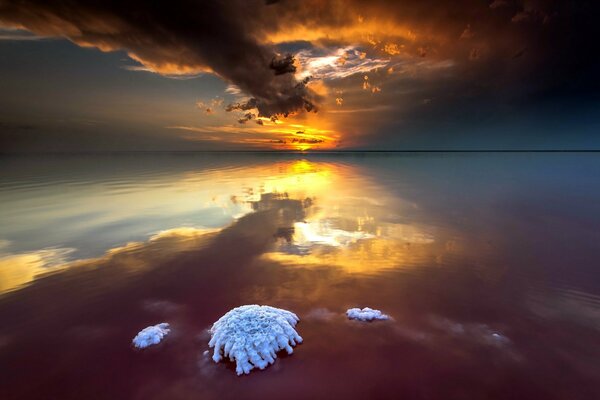 A beautiful sunset is reflected in the sea