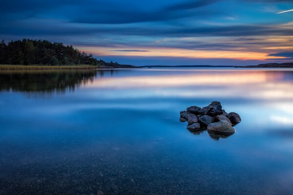 Quiet water. Stones in the water surface