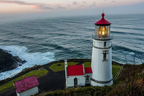 Lighthouse on a rock by the sea