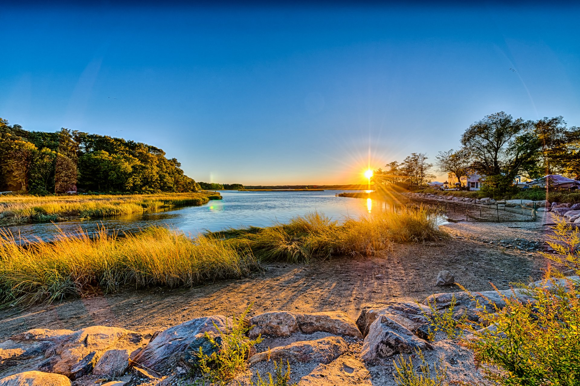 long island new york états-unis ciel soleil coucher de soleil rivière côte pierres herbe arbres maison nature