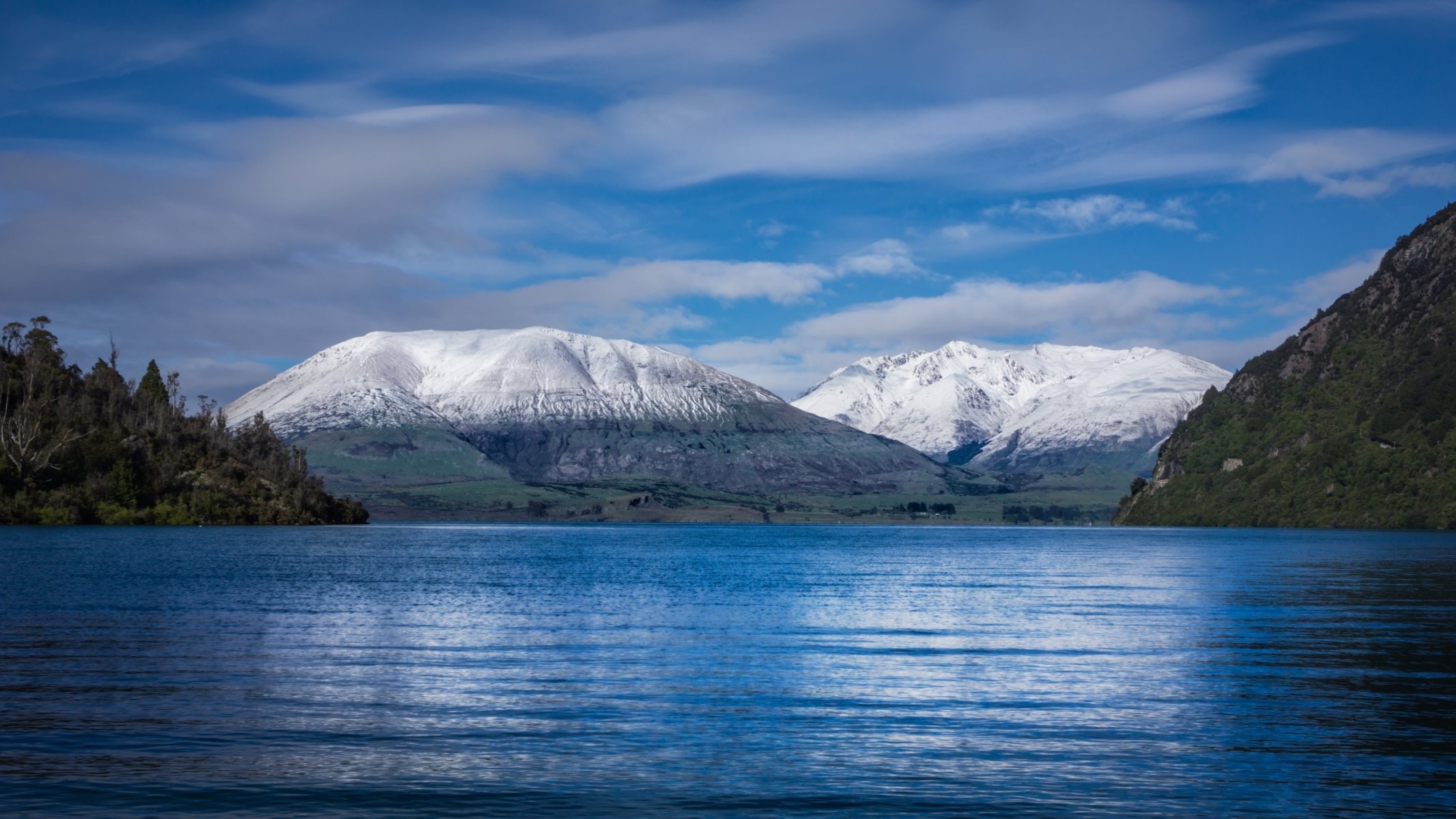 landscape sea water excitement land beach forest mountain tops snow sky cloud