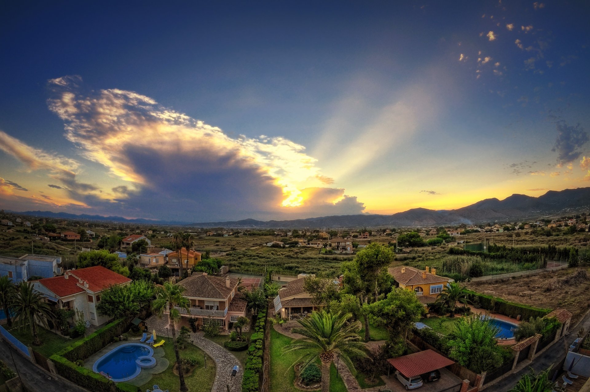 castellon spain valley houses pool tree sky clouds sunset