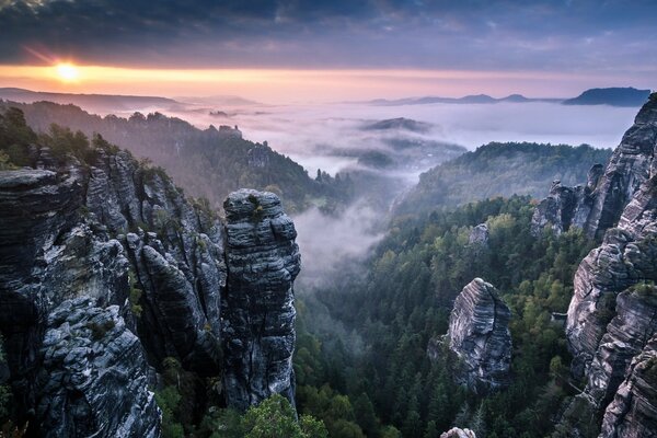 Oblada rocks from the fog . Landscape Saxon Switzerland