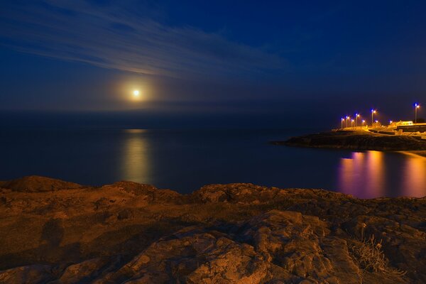 Moonlight path at night on the sea