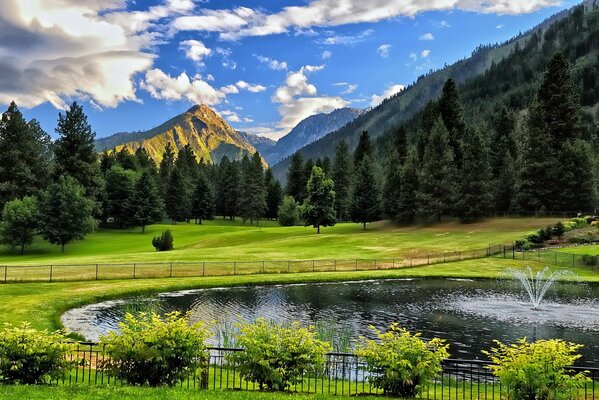 Photo de montagne et étang avec fontaine