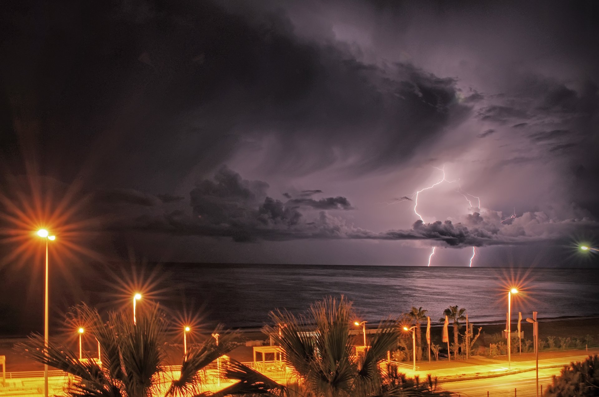 ea beach embankment night lighting lights sky clouds lightning