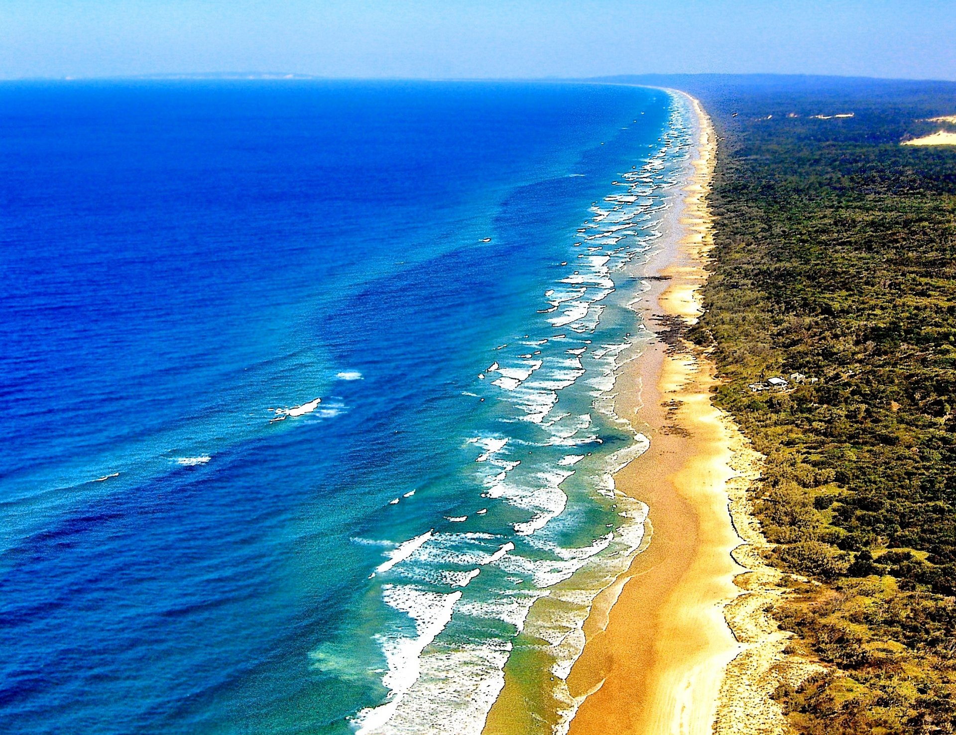 ea waves beach sand vegetation fraser island queensland australia