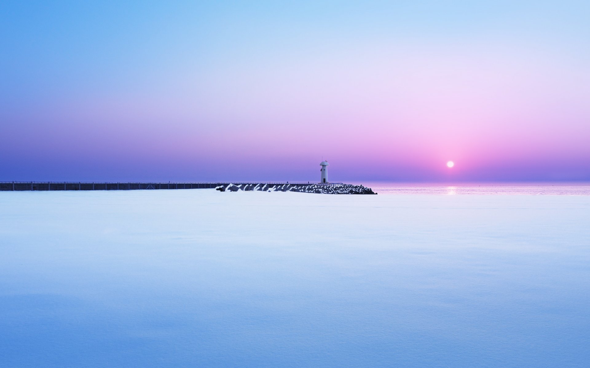 mare molo faro neve inverno mattina alba