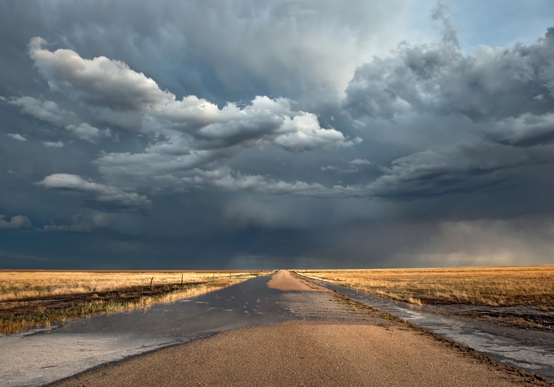 of the field road pools clouds after the rain