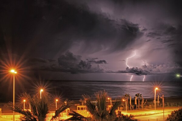 Night thunderstorm with lightning in the sea