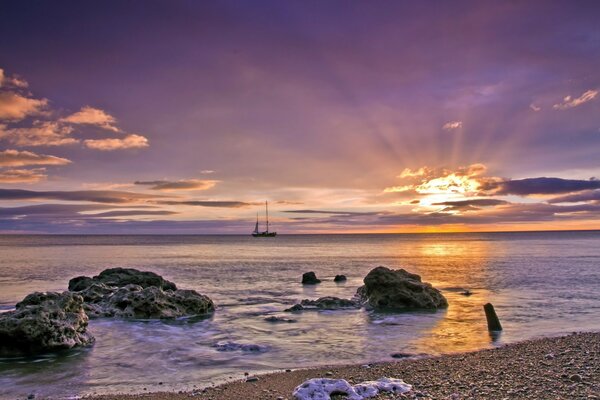 Brossky landscape koroblya at sunset in the sea