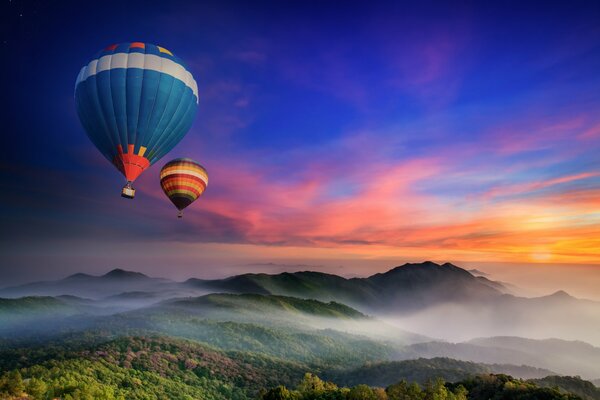 Bright balloons over the mountains