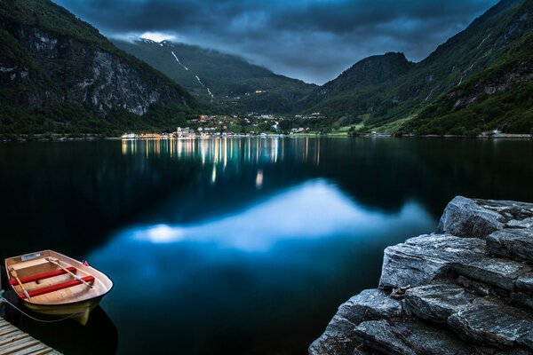 Boat on the lake and mountains in Norway