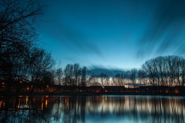 A lake in the rays of a twilight sunset