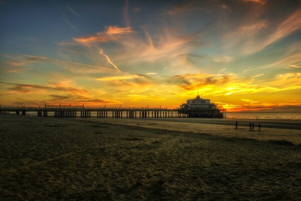 Sunset on the pier by the sea