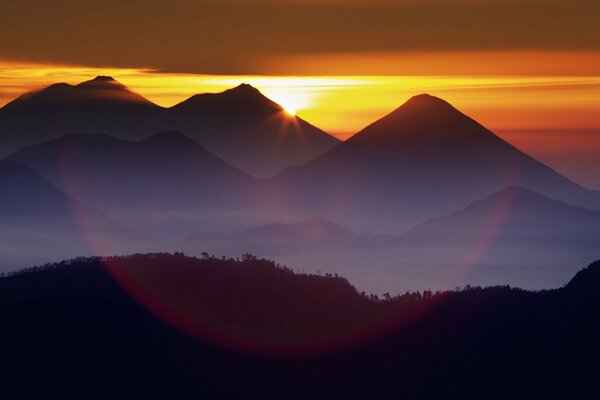 Atmospheric view of the mountains, clouds