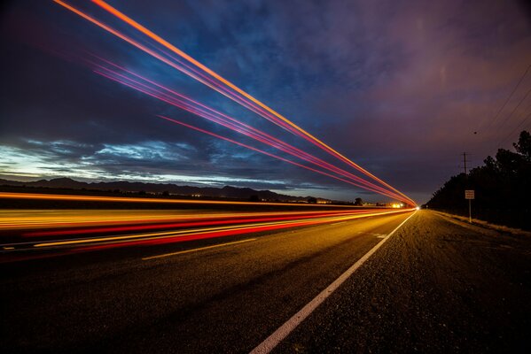 Evening lights of cars on the road