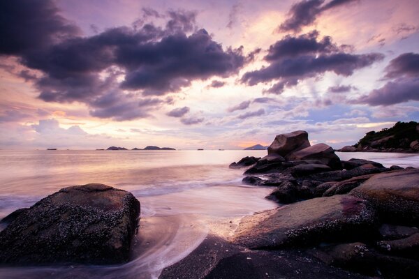 Lilac sunset on the sea beach