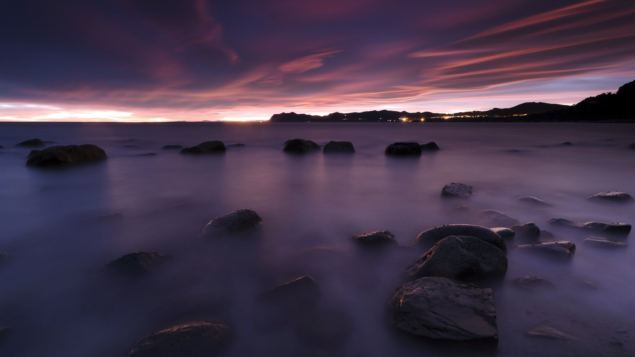 puesta de sol mar piedras