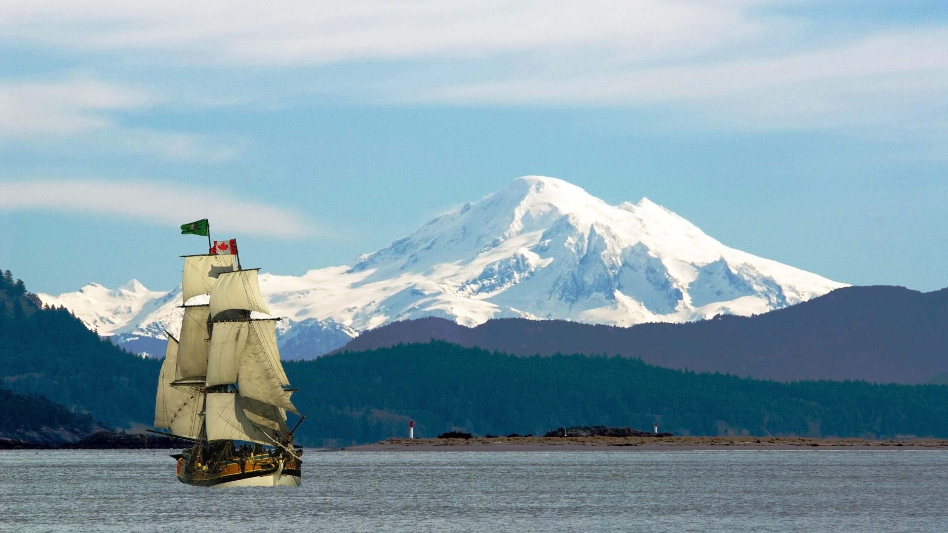 île vancouver canada montagnes neige sommets rivière navire voilier drapeau