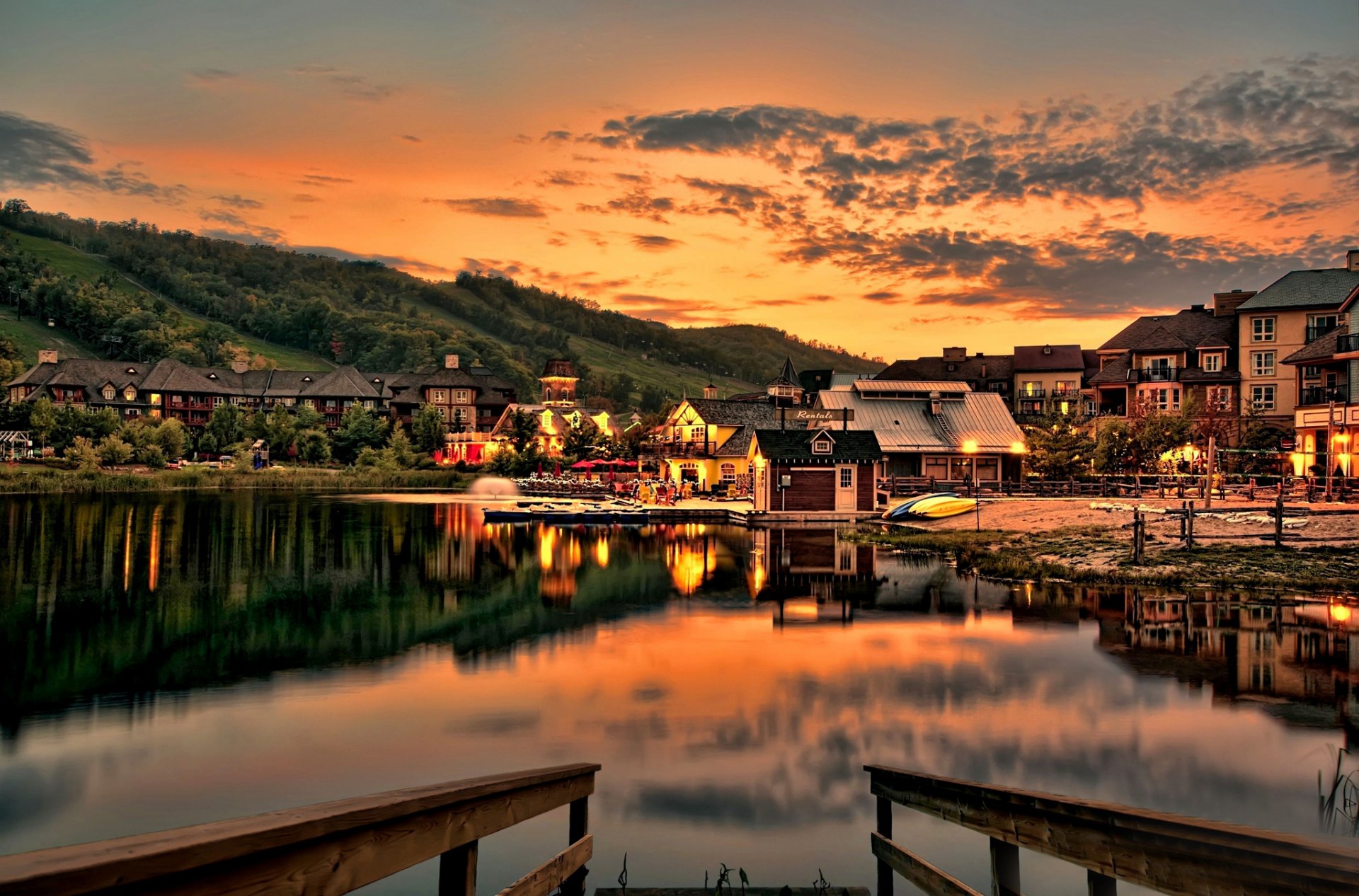 mountain slope village lake sunset night light