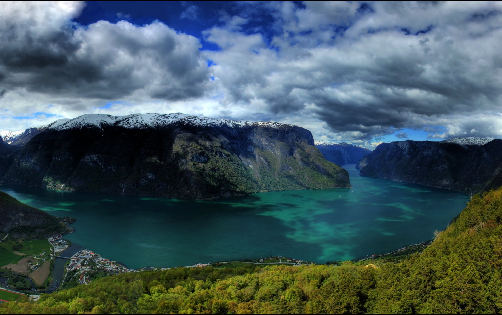 norway mountains lake rocks mountains snow clouds clouds forest nature town