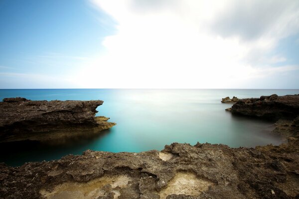 Beautiful landscape of the stone coast with a cloudy sky