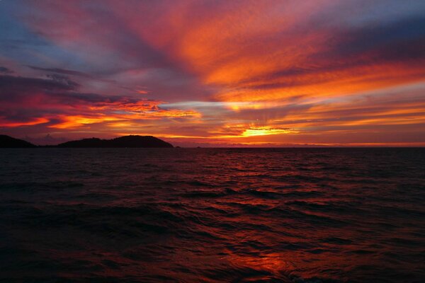 The sea on the background of a red sunset