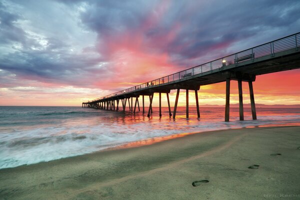 Pier on the background of a beautiful sunset