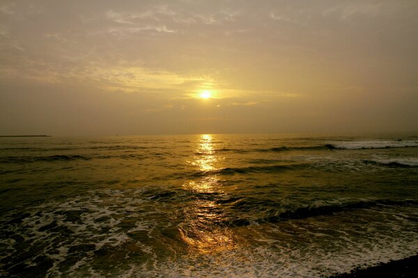 Small waves on the background of sunset