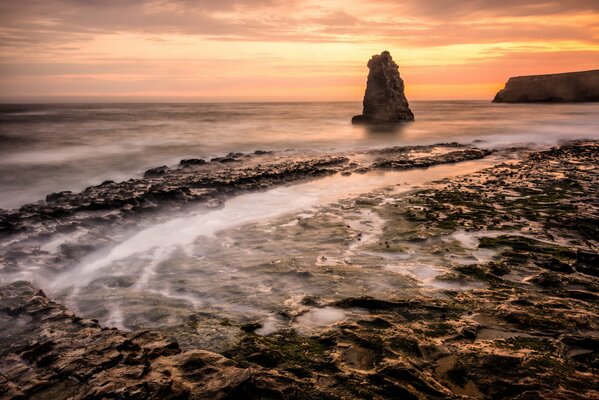 Bright dawn on a stone beach